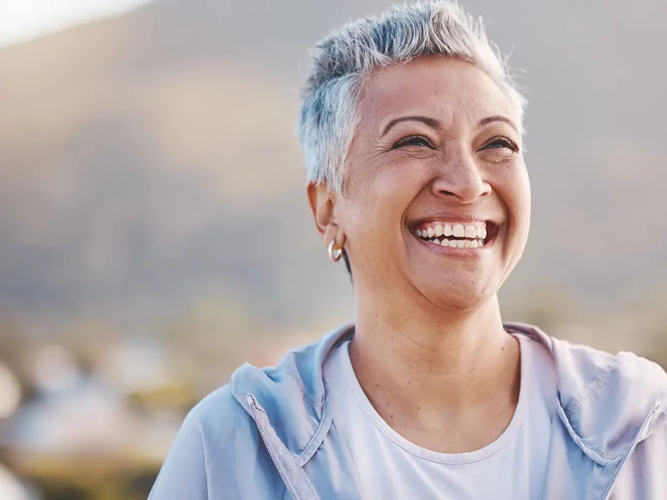Patient receiving new replacement dentures at a Houston dental office