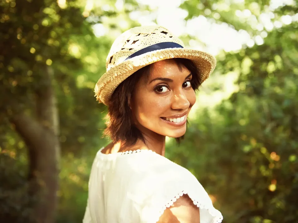 Young woman smiling confidently after her dental implant procedure